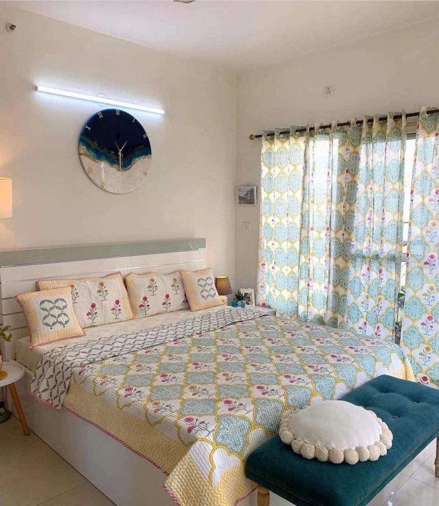 a Soft Layered Bedroom With Patterned Bedding