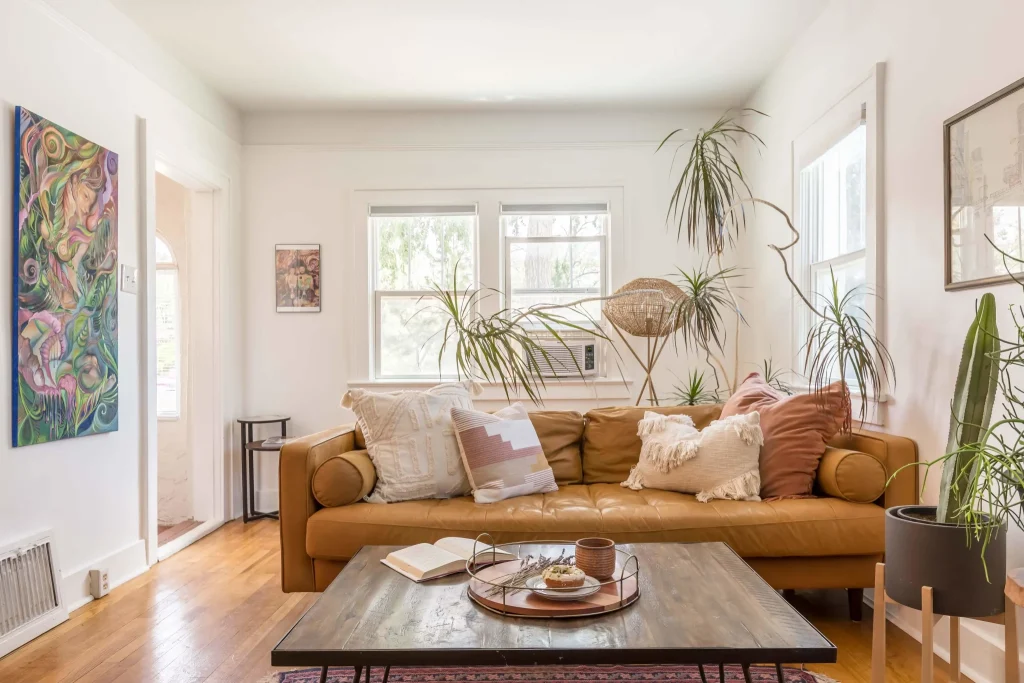 Small-living-room-with-tan-sofa-and-natural-light-2048x1365