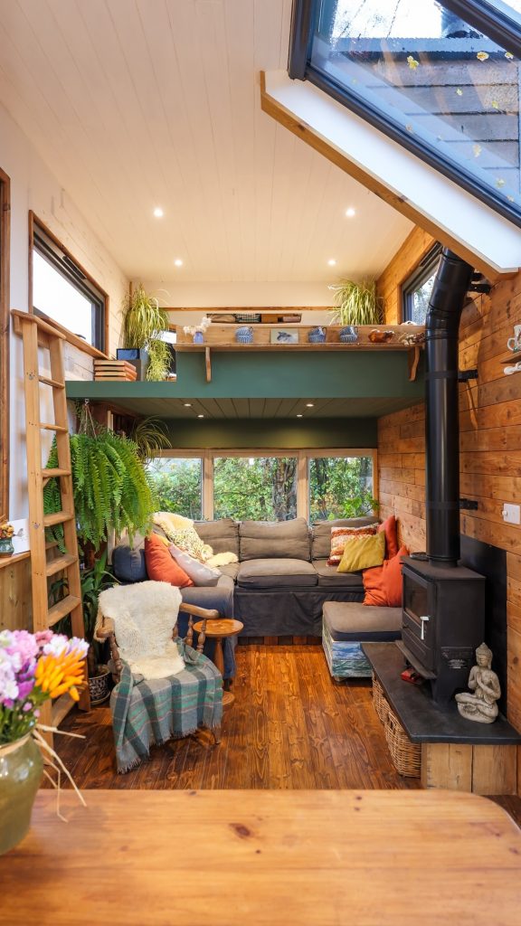 Tuck a Sectional Under the Loft and Warm It with a Wood Stove