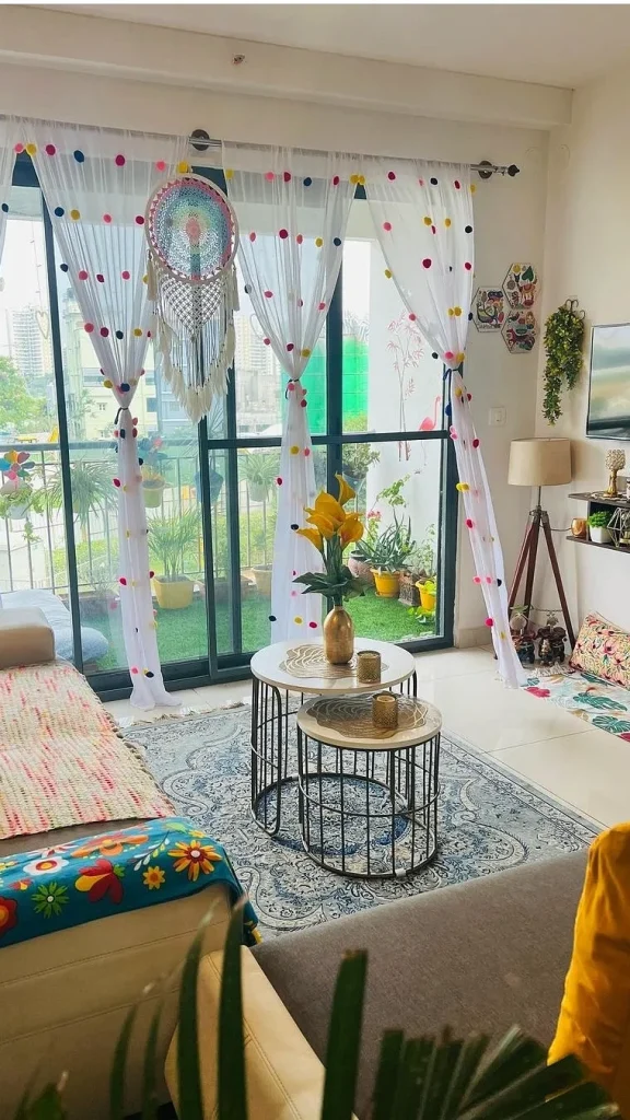 Dress Sheer Curtains with Pom-Poms to Soften a Glass Wall